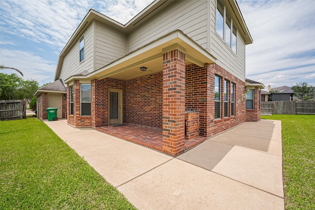 4142 Regal Stone Ln, Sugar Land, TX 77479 - view of property exterior with brick siding and a patio