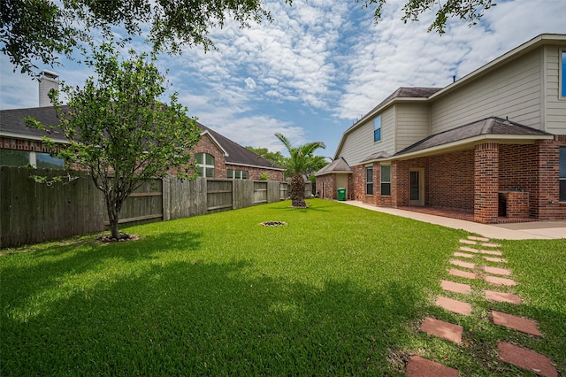 4142 Regal Stone Ln, Sugar Land, TX 77479 - fenced backyard featuring a patio area