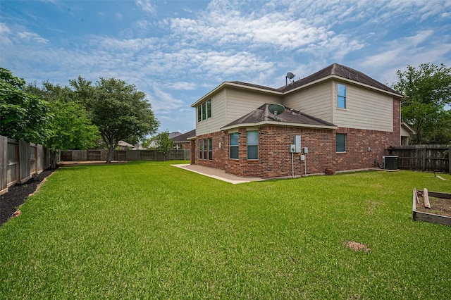4142 Regal Stone Ln, Sugar Land, TX 77479 - back of property featuring brick siding, a fenced backyard, and a patio