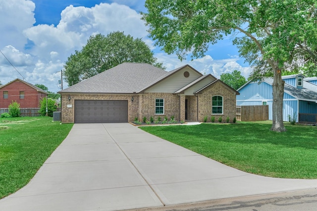 10477 Valley Dr N, Willis, TX 77318 - ranch-style home with brick siding, a garage, and driveway