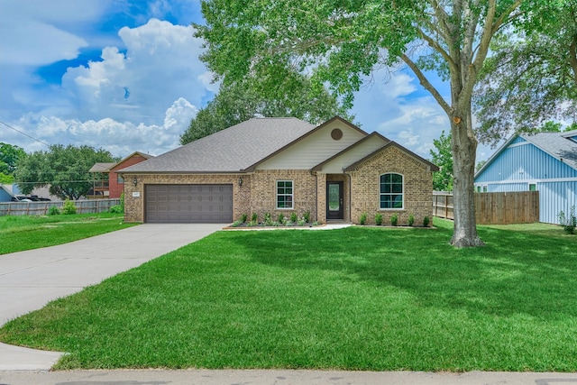 10477 Valley Dr N, Willis, TX 77318 - single story home with an attached garage, concrete driveway, and brick siding