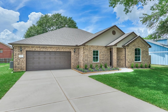 10477 Valley Dr N, Willis, TX 77318 - view of front of property featuring brick siding, an attached garage, concrete driveway, and a front lawn