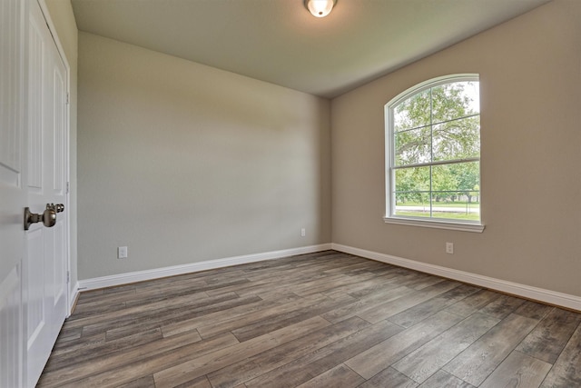10477 Valley Dr N, Willis, TX 77318 - empty room featuring dark wood-style flooring and baseboards