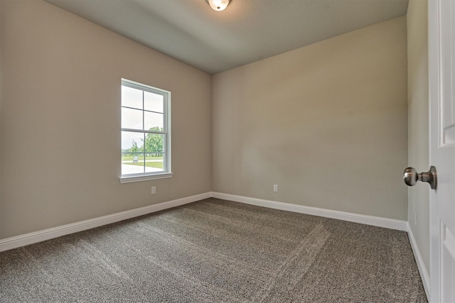 10477 Valley Dr N, Willis, TX 77318 - carpeted empty room with baseboards