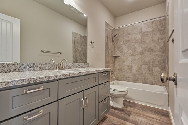 10477 Valley Dr N, Willis, TX 77318 - full bath with vanity, wood finished floors, and shower / tub combination