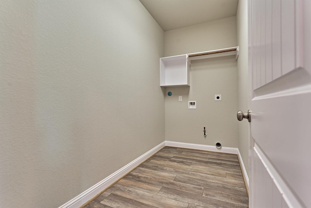 10477 Valley Dr N, Willis, TX 77318 - laundry area with hookup for an electric dryer, wood finished floors, and hookup for a washing machine