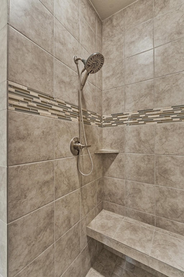 10477 Valley Dr N, Willis, TX 77318 - full bathroom featuring a tile shower