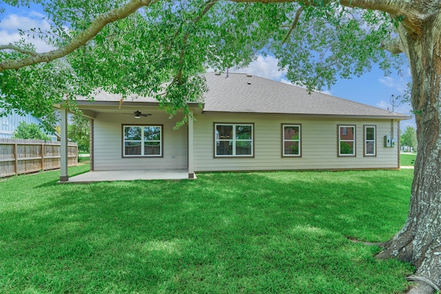 10477 Valley Dr N, Willis, TX 77318 - rear view of property with ceiling fan, a patio area, and roof with shingles