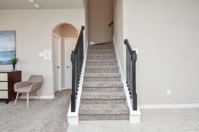 3514 Marquesa Ln, Houston, TX 77084 - staircase featuring baseboards and arched walkways