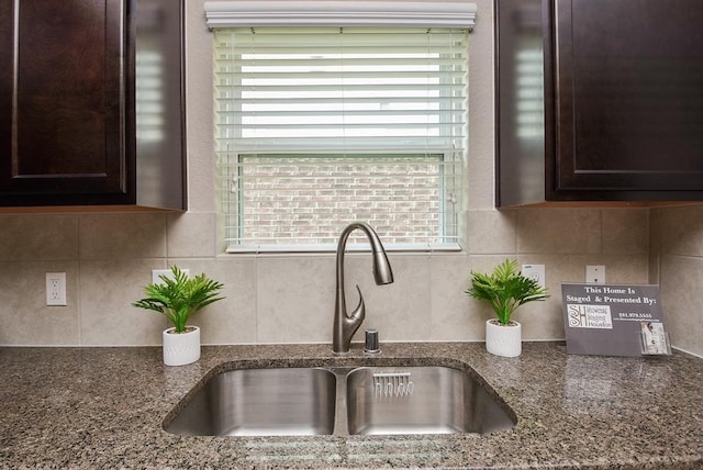 3514 Marquesa Ln, Houston, TX 77084 - detailed view of dark brown cabinets, backsplash, and dark stone counters