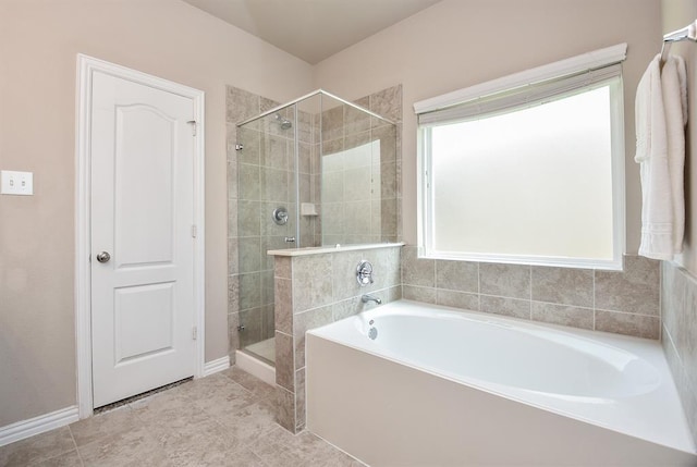 3514 Marquesa Ln, Houston, TX 77084 - full bathroom with a bath, a shower stall, and tile patterned flooring