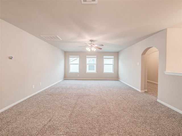 3514 Marquesa Ln, Houston, TX 77084 - spare room featuring light colored carpet, ceiling fan, and arched walkways