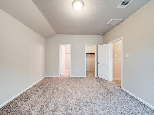 3514 Marquesa Ln, Houston, TX 77084 - unfurnished bedroom featuring carpet, a walk in closet, lofted ceiling, and a closet