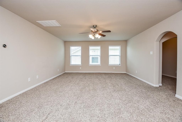 3514 Marquesa Ln, Houston, TX 77084 - spare room featuring carpet floors, arched walkways, and ceiling fan