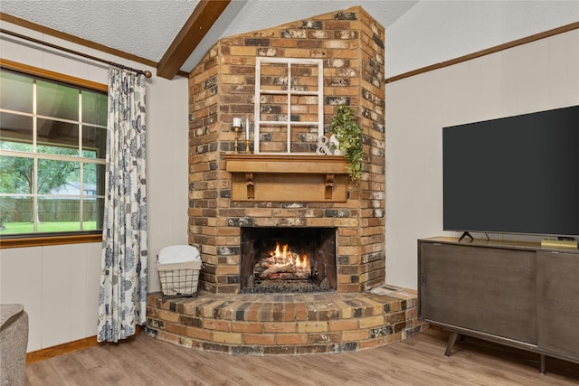 2006 Echo Ridge Ct, Houston, TX 77339 - living room with wood finished floors, a brick fireplace, and a textured ceiling