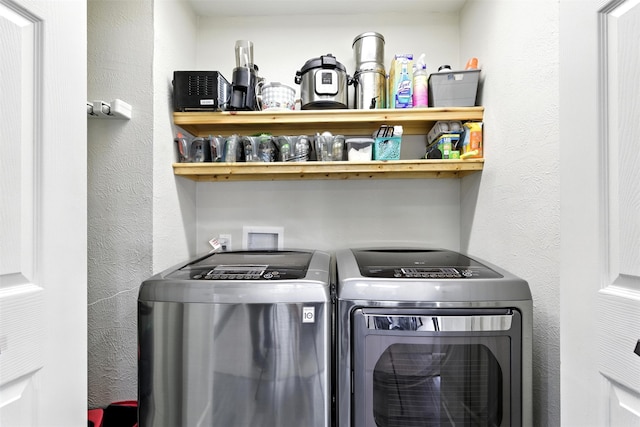 530 W Sherwood Forest Dr W, Woodville, TX 75979 - washroom featuring washing machine and dryer and a textured wall