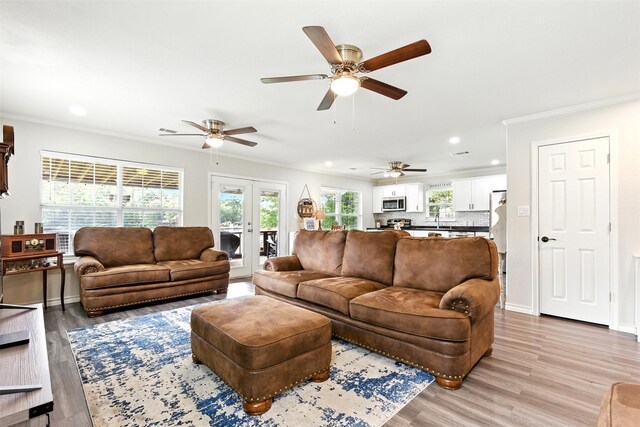 530 W Sherwood Forest Dr W, Woodville, TX 75979 - living area with ornamental molding, light wood-style floors, recessed lighting, french doors, and ceiling fan