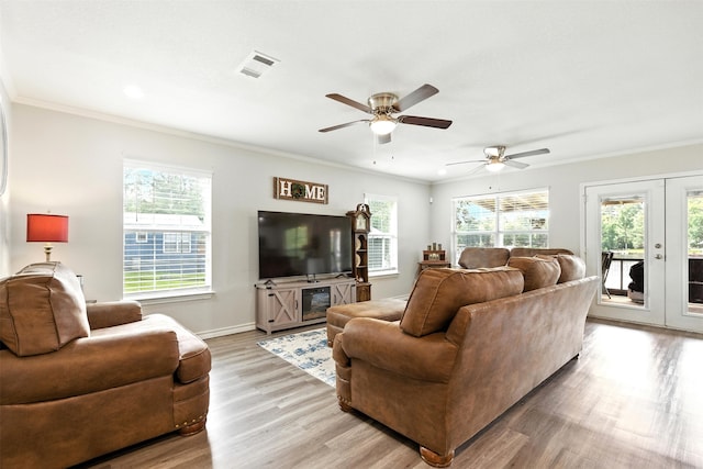 530 W Sherwood Forest Dr W, Woodville, TX 75979 - living room featuring crown molding, french doors, light wood-type flooring, ceiling fan, and recessed lighting