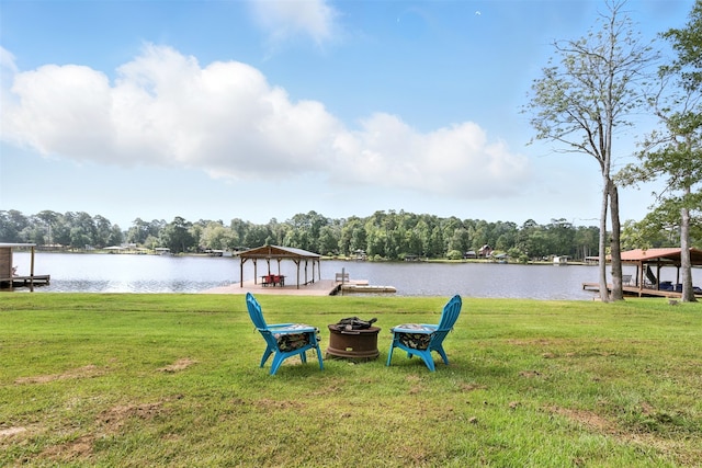 530 W Sherwood Forest Dr W, Woodville, TX 75979 - view of green lawn with a gazebo, a fire pit, and a water view