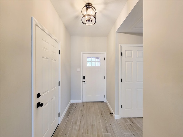 18106 Water Mill Dr, Cypress, TX 77429 - foyer entrance featuring light wood-style flooring and a chandelier