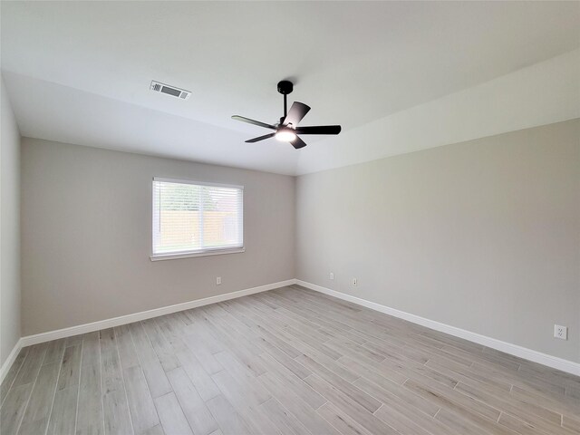 18106 Water Mill Dr, Cypress, TX 77429 - empty room with light wood-style flooring and a ceiling fan