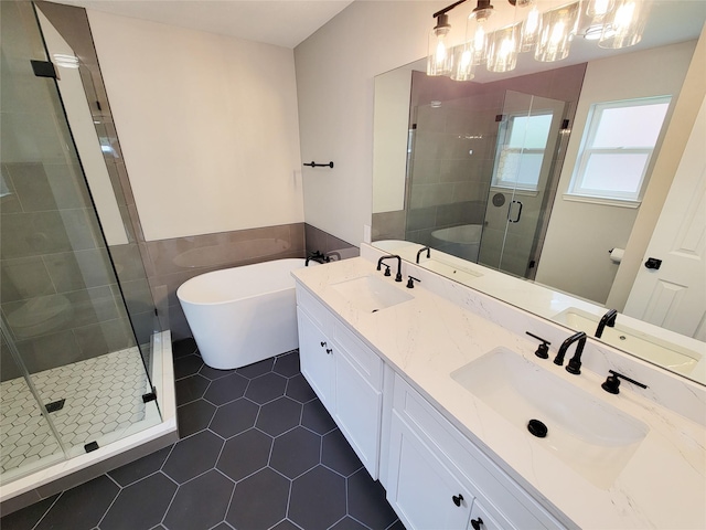 18106 Water Mill Dr, Cypress, TX 77429 - bathroom featuring double vanity, tile patterned flooring, a shower stall, and a freestanding tub