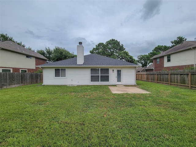 18106 Water Mill Dr, Cypress, TX 77429 - rear view of house featuring a patio, a fenced backyard, and a chimney