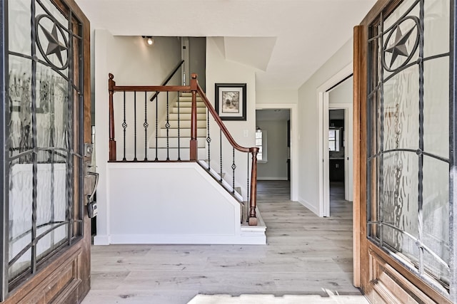 1201 Shady Oak Ln, Dickinson, TX 77539 - foyer entrance featuring stairs and wood finished floors