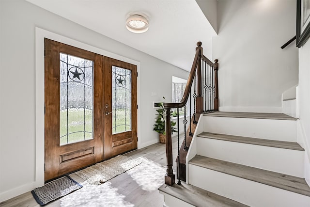 1201 Shady Oak Ln, Dickinson, TX 77539 - foyer with plenty of natural light, stairs, and french doors
