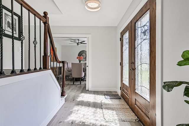 1201 Shady Oak Ln, Dickinson, TX 77539 - foyer entrance featuring stairway, french doors, plenty of natural light, and wood finished floors