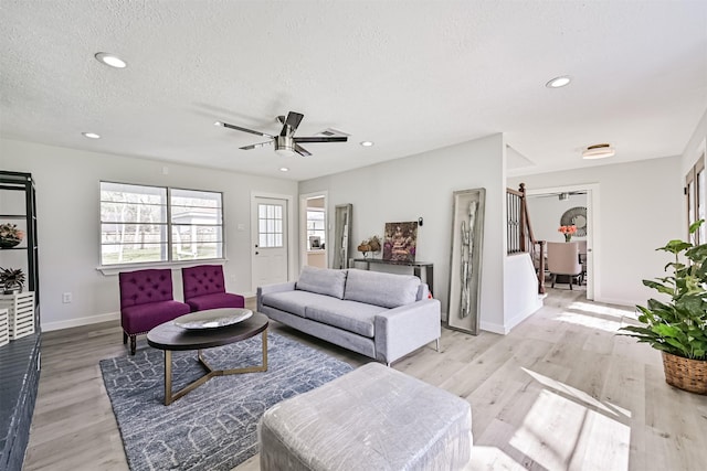 1201 Shady Oak Ln, Dickinson, TX 77539 - living room featuring ceiling fan, light wood-style floors, a textured ceiling, and recessed lighting