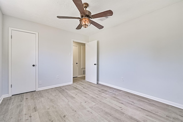 1201 Shady Oak Ln, Dickinson, TX 77539 - unfurnished bedroom featuring light wood finished floors and ceiling fan