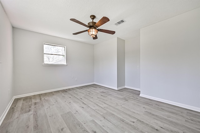 1201 Shady Oak Ln, Dickinson, TX 77539 - unfurnished room with a ceiling fan, wood finished floors, and a textured ceiling