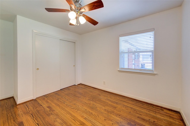 4538 Warm Springs Rd, Houston, TX 77035 - unfurnished bedroom featuring a closet, wood finished floors, and a ceiling fan