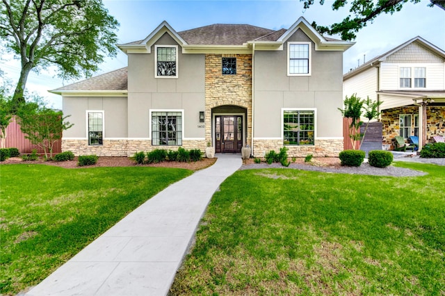 1403 Wakefield Dr, Houston, TX 77018 - view of front of property with stone siding, stucco siding, a shingled roof, and a front yard