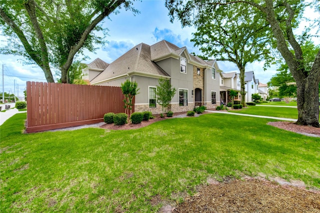 1403 Wakefield Dr, Houston, TX 77018 - view of side of home featuring stucco siding, stone siding, and a shingled roof