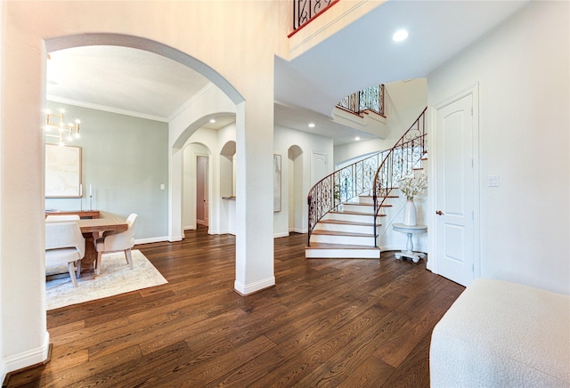 1403 Wakefield Dr, Houston, TX 77018 - foyer with ornamental molding, wood finished floors, stairway, arched walkways, and recessed lighting