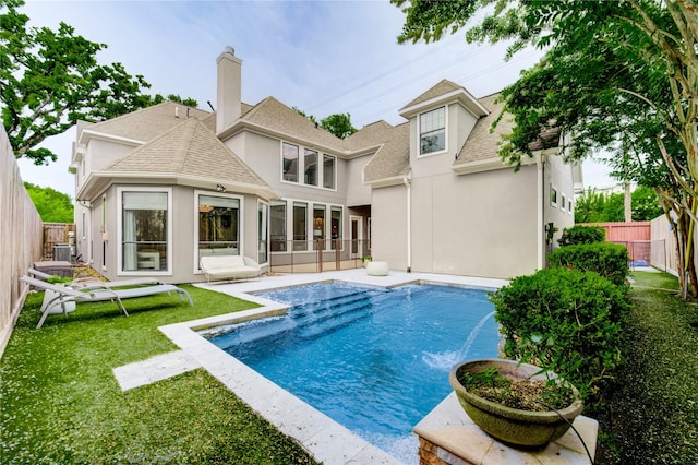 1403 Wakefield Dr, Houston, TX 77018 - back of property featuring a shingled roof, stucco siding, a fenced backyard, and a chimney