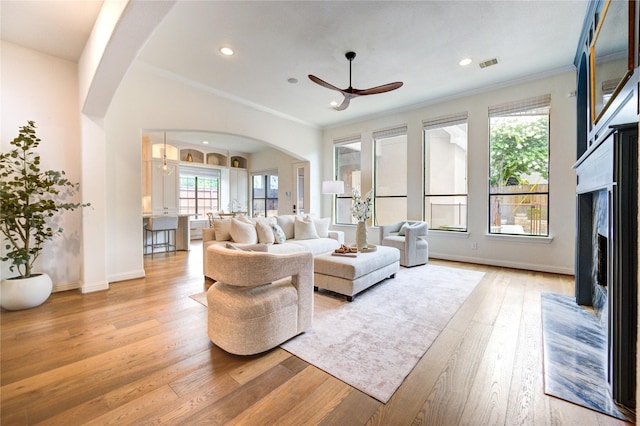 1403 Wakefield Dr, Houston, TX 77018 - living room with arched walkways, ceiling fan, light wood-style floors, healthy amount of natural light, and recessed lighting