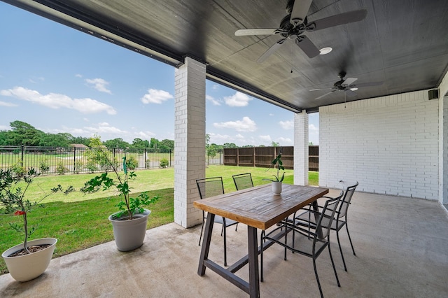 6618 Mirabeau Ln, Katy, TX 77493 - fenced backyard with outdoor dining area, ceiling fan, and a patio area
