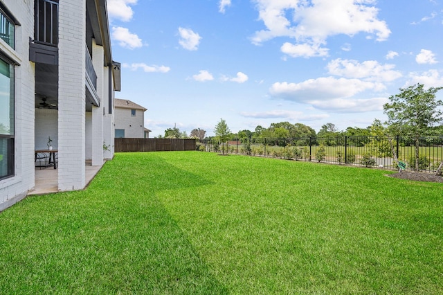 6618 Mirabeau Ln, Katy, TX 77493 - fenced backyard with a patio and a ceiling fan