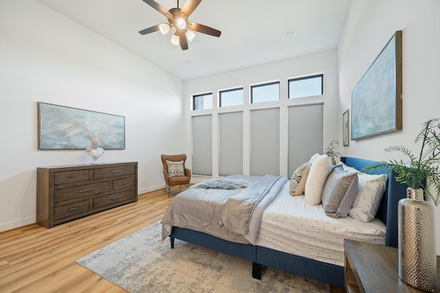 6618 Mirabeau Ln, Katy, TX 77493 - bedroom with wood finished floors, lofted ceiling, and a ceiling fan