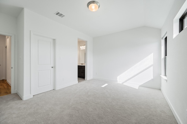 6618 Mirabeau Ln, Katy, TX 77493 - unfurnished bedroom with carpet flooring, vaulted ceiling, and ensuite bathroom