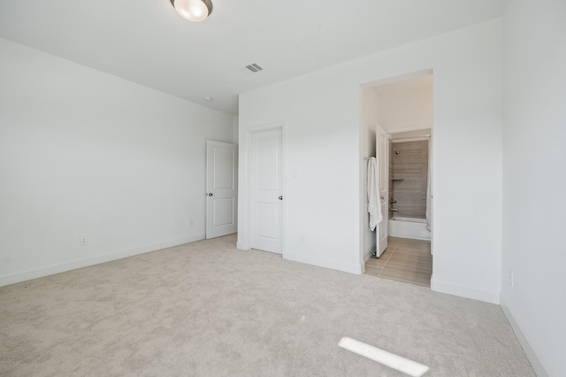 6618 Mirabeau Ln, Katy, TX 77493 - unfurnished bedroom with light colored carpet and ensuite bath