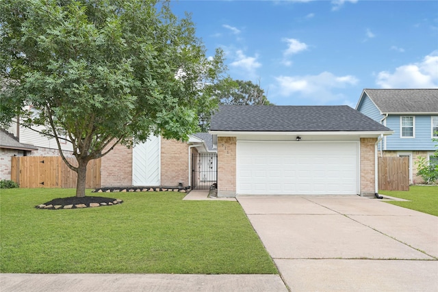 711 Charidges Dr, Houston, TX 77034 - view of front of property featuring an attached garage, driveway, brick siding, and a gate