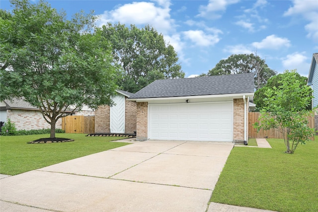 711 Charidges Dr, Houston, TX 77034 - view of front of home with driveway, roof with shingles, brick siding, and a garage