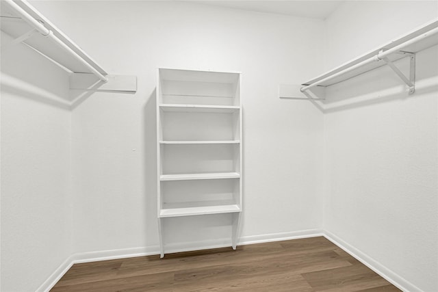 711 Charidges Dr, Houston, TX 77034 - spacious closet featuring wood finished floors