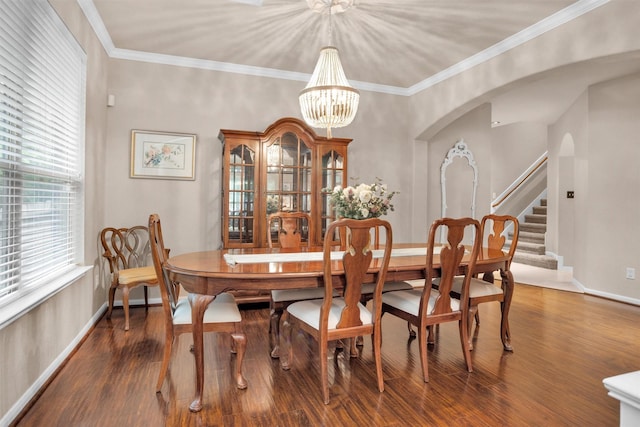 1900 Pagemill Ln, Conroe, TX 77304 - dining room featuring a chandelier, stairs, wood finished floors, arched walkways, and ornamental molding