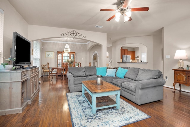 1900 Pagemill Ln, Conroe, TX 77304 - living room with arched walkways, dark wood-style floors, and ceiling fan