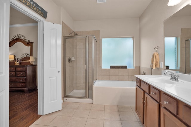 1900 Pagemill Ln, Conroe, TX 77304 - bathroom featuring vanity, a stall shower, a bath, and tile patterned flooring